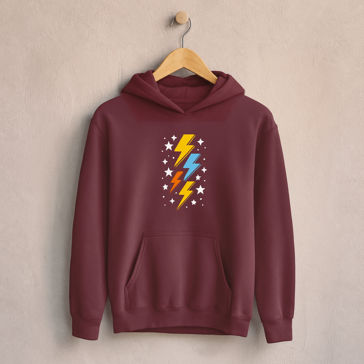 Retro Colorful Thunderbolt – Kids Classic Hoodie Sweatshirt on a wooden hanger and wall peg, with a naturally collapsed hood